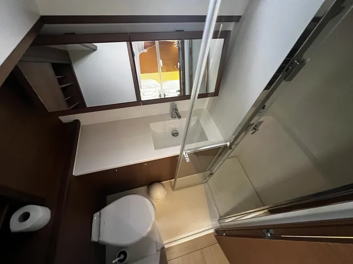  Yacht Photos Pics Bathroom interior of 2019 Lagoon 52 F yacht with shower and toilet.