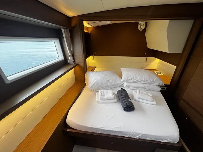  Yacht Photos Pics Luxurious cabin interior of 2019 Lagoon 52 F yacht with ocean view window.