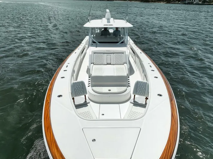 Sapelo Yacht Photos Pics 2024 Front Runner 47 Center Console boat on water, featuring sleek design and spacious deck.