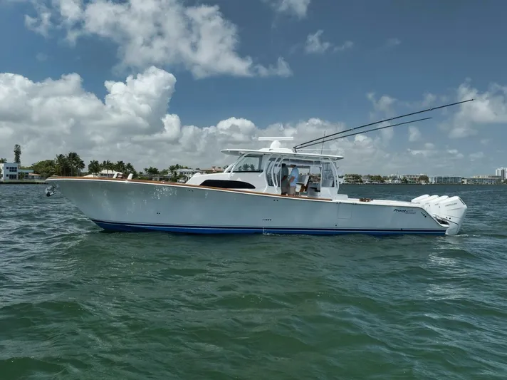 Sapelo Yacht Photos Pics 2024 Front Runner 47 Center Console boat on water under blue sky.