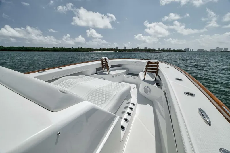 Sapelo Yacht Photos Pics 2024 Front Runner 47 Center Console boat on water, featuring sleek design and comfortable seating.