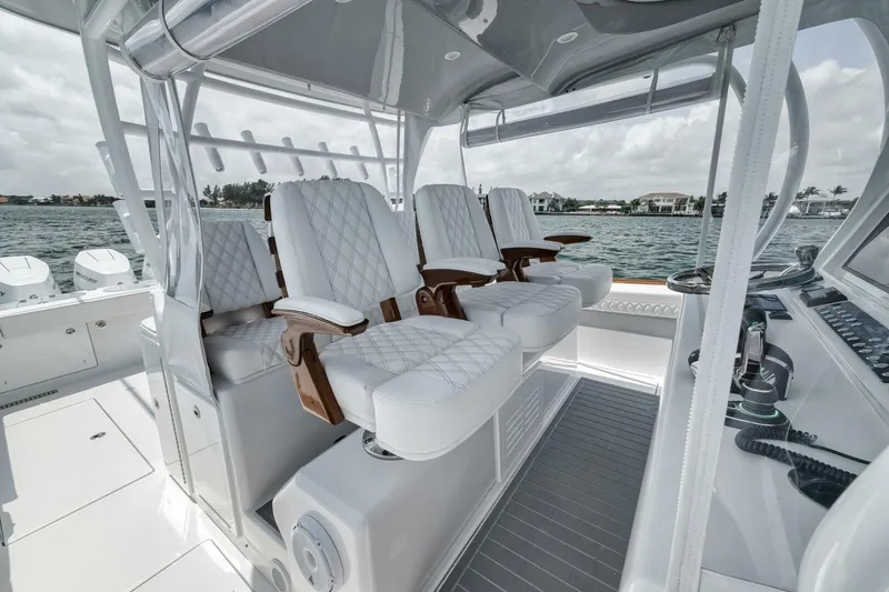 Sapelo Yacht Photos Pics Luxurious seating on 2024 Front Runner 47 Center Console boat, featuring elegant white upholstery.