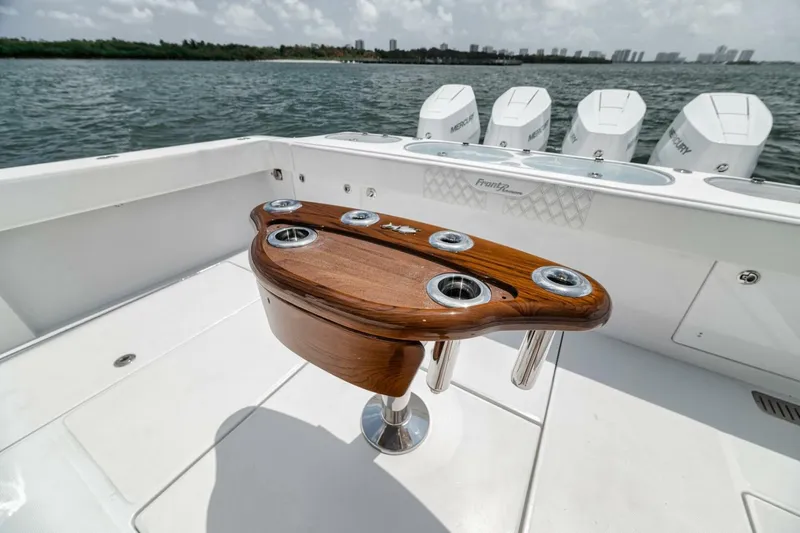 Sapelo Yacht Photos Pics 2024 Front Runner 47 Center Console boat with wooden rod holder, ocean view.
