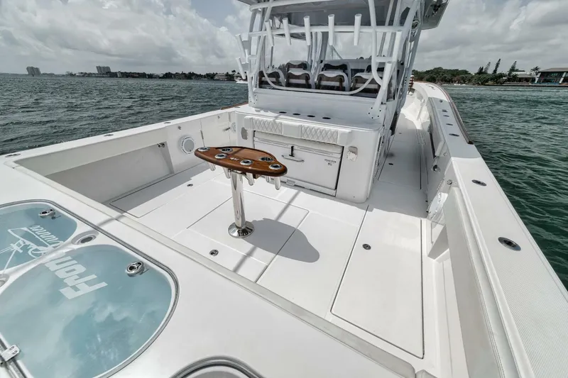 Sapelo Yacht Photos Pics 2024 Front Runner 47 Center Console boat on water, featuring spacious deck and seating.