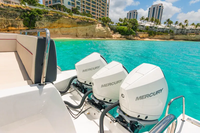  Yacht Photos Pics 2025 Jeanneau Cap Camarat 12.5 WA with triple Mercury engines in turquoise waters.