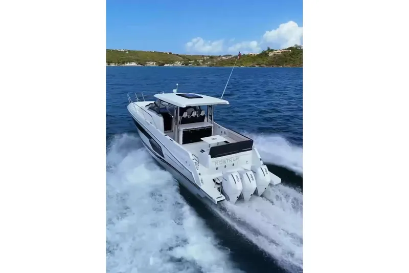  Yacht Photos Pics 2025 Jeanneau Cap Camarat 12.5 WA cruising on open water, showcasing powerful engines.