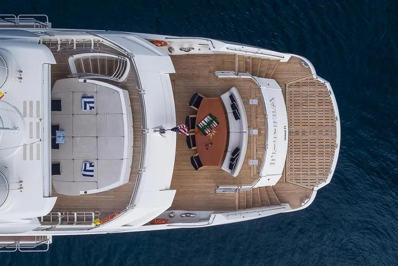 Insignia Yacht Photos Pics Aerial view of 2015 Sunseeker 115 yacht deck with seating and dining area.