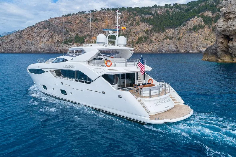 Insignia Yacht Photos Pics Luxurious 2015 Sunseeker 115 yacht cruising in scenic coastal waters.
