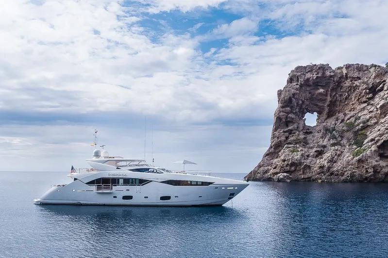 Insignia Yacht Photos Pics Luxury Sunseeker 115 yacht cruising near rocky coastline, 2015 model.