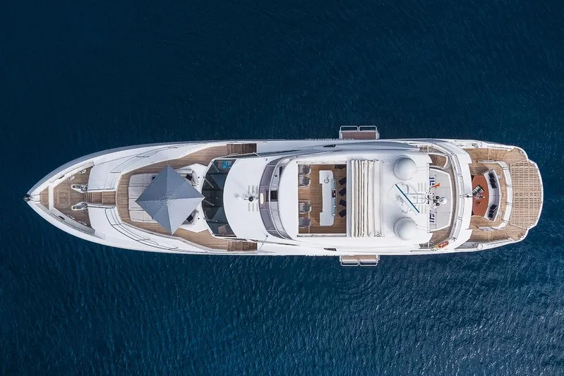 Insignia Yacht Photos Pics Overhead view of a 2015 Sunseeker 115 yacht on deep blue water.