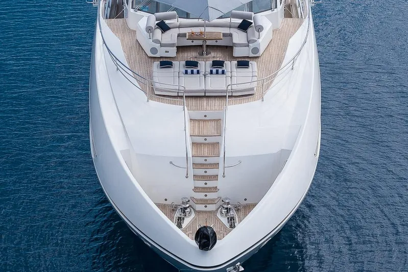 Insignia Yacht Photos Pics Luxurious 2015 Sunseeker 115 yacht on calm blue water, aerial view.