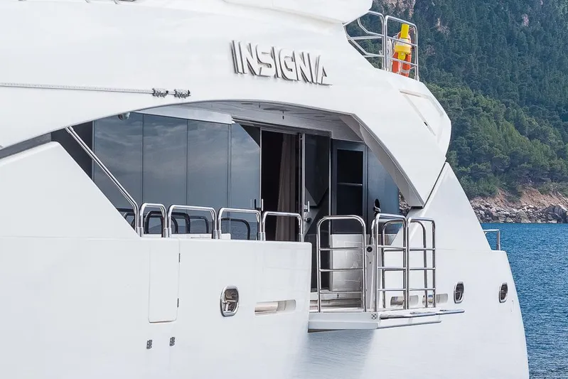 Insignia Yacht Photos Pics Luxury Sunseeker 115 yacht "Insignia" docked by scenic coastline, 2015 model.