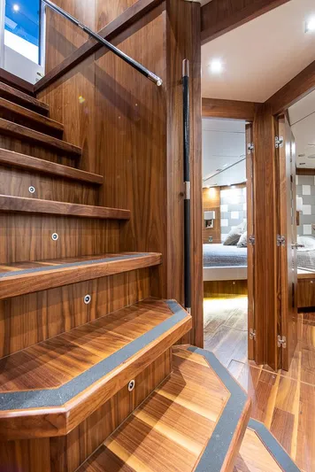 Insignia Yacht Photos Pics Luxurious wooden staircase and cabin interior of 2015 Sunseeker 115 yacht.