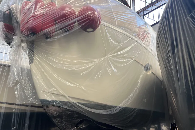  Yacht Photos Pics Cantieri Estensi Goldstar 42 Fly 2009 yacht wrapped in protective plastic in a warehouse.