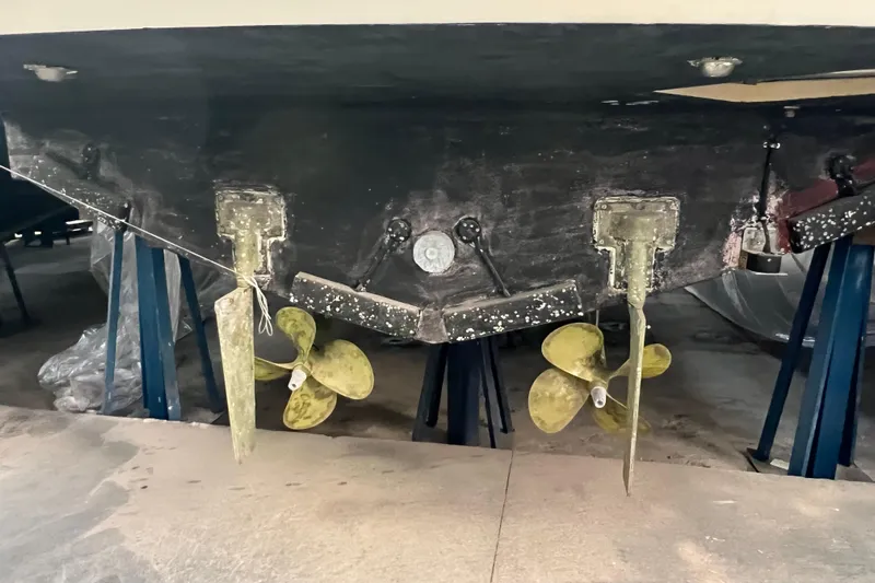  Yacht Photos Pics 2009 Cantieri Estensi Goldstar 42 Fly yacht under maintenance, showing propellers and rudders.