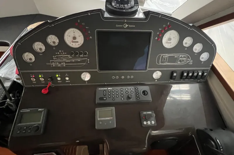  Yacht Photos Pics Control panel of 2009 Cantieri Estensi Goldstar 42 Fly yacht with gauges and navigation equipment.