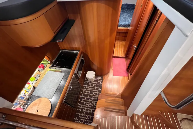  Yacht Photos Pics Interior of 2009 Cantieri Estensi Goldstar 42 Fly yacht, featuring a compact kitchen area.