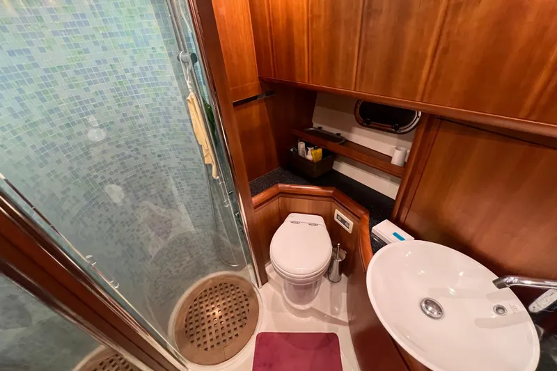  Yacht Photos Pics Bathroom interior of 2009 Cantieri Estensi Goldstar 42 Fly yacht with shower and sink.