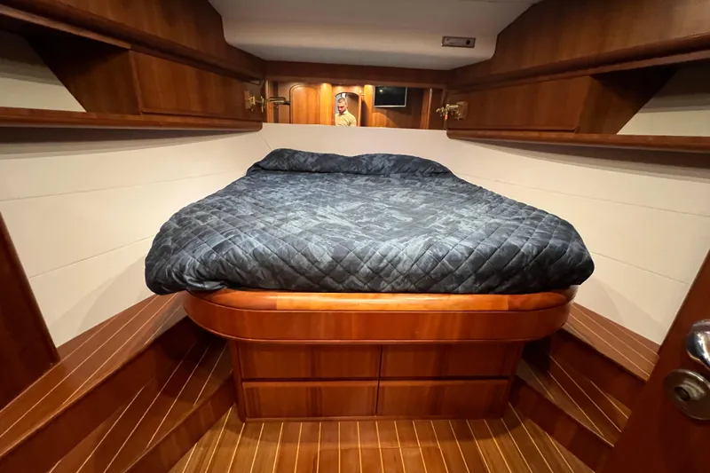  Yacht Photos Pics Luxurious cabin interior of 2009 Cantieri Estensi Goldstar 42 Fly yacht with wooden finish.