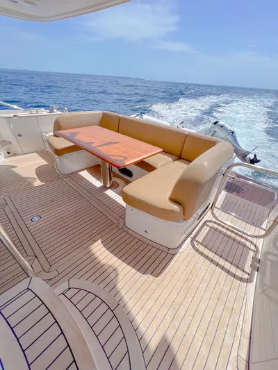  Yacht Photos Pics Luxury Princess 60 yacht deck with seating, cruising on open sea, 2013 model.