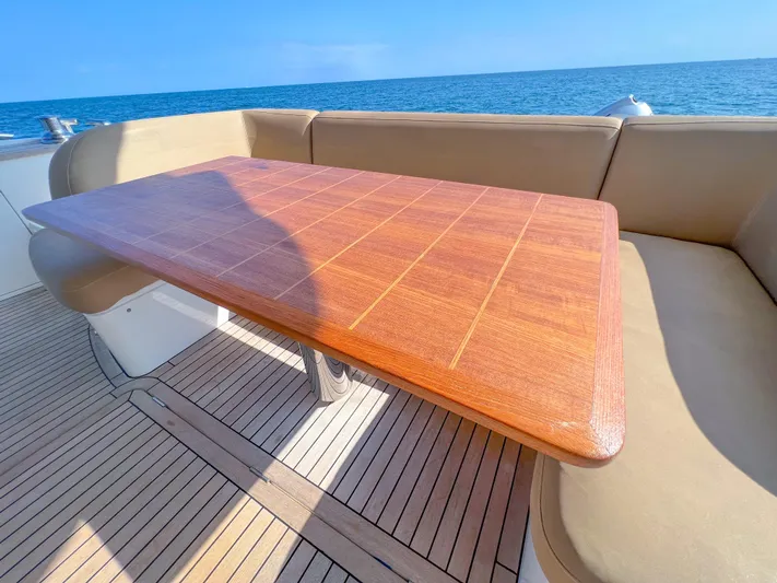  Yacht Photos Pics Luxurious Princess 60 yacht deck with wooden table, 2013 model, ocean view.