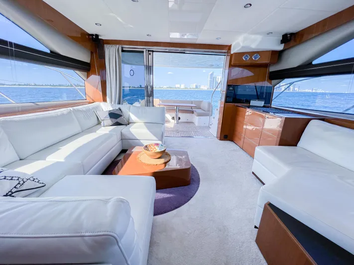  Yacht Photos Pics Luxurious interior of 2013 Princess 60 yacht with white seating and ocean view.
