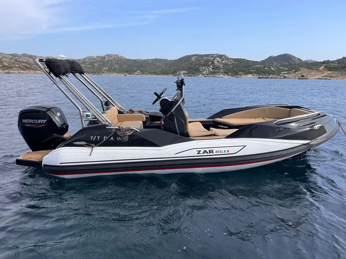 Dawn Yacht Photos Pics Luxury Sunreef 60 yacht on calm waters, 2019 model, with scenic mountainous backdrop.