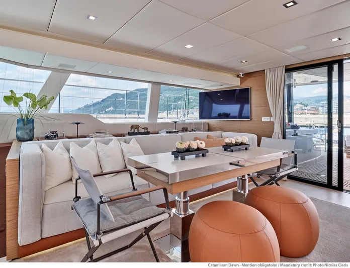 Dawn Yacht Photos Pics Luxurious interior of 2019 Sunreef 60 catamaran with modern decor and panoramic views.