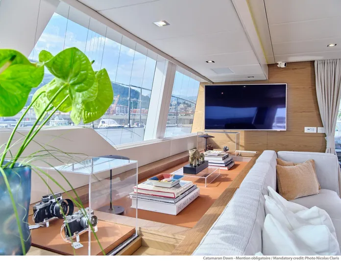 Dawn Yacht Photos Pics Luxurious Sunreef 60 catamaran interior with modern decor and large windows, 2019 model.