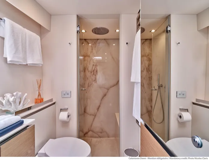 Dawn Yacht Photos Pics Luxurious bathroom on 2019 Sunreef 60 yacht with marble shower and modern fixtures.