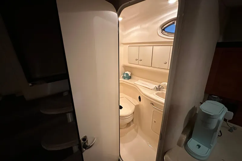  Yacht Photos Pics Interior view of 2004 Sea Ray 340 Sundancer bathroom with modern amenities.