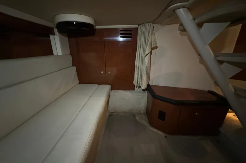  Yacht Photos Pics Interior of 2004 Sea Ray 340 Sundancer with seating and wooden cabinetry.
