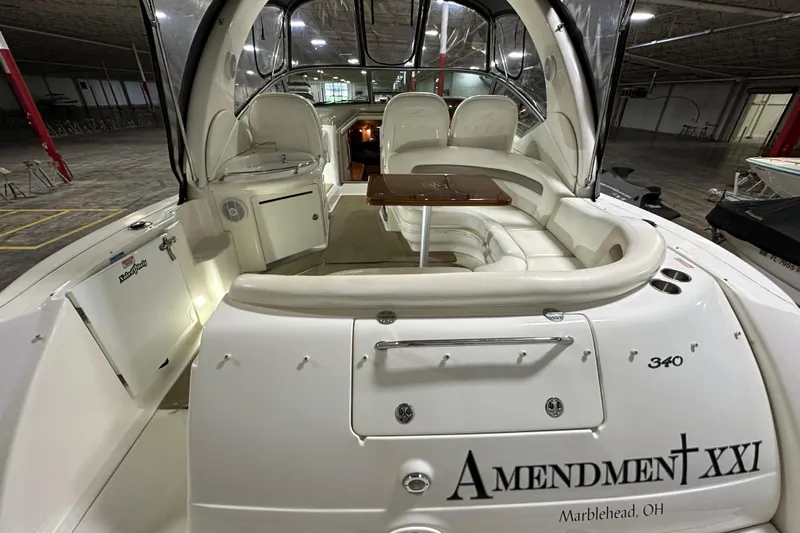  Yacht Photos Pics 2004 Sea Ray 340 Sundancer interior with seating and table, docked in Marblehead, OH.