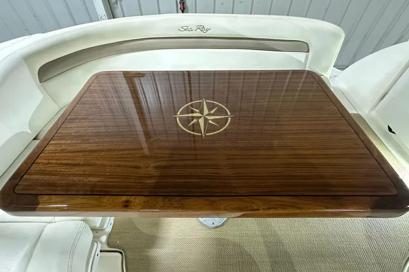 Yacht Photos Pics Polished wooden table with compass design on 2004 Sea Ray 340 Sundancer boat.