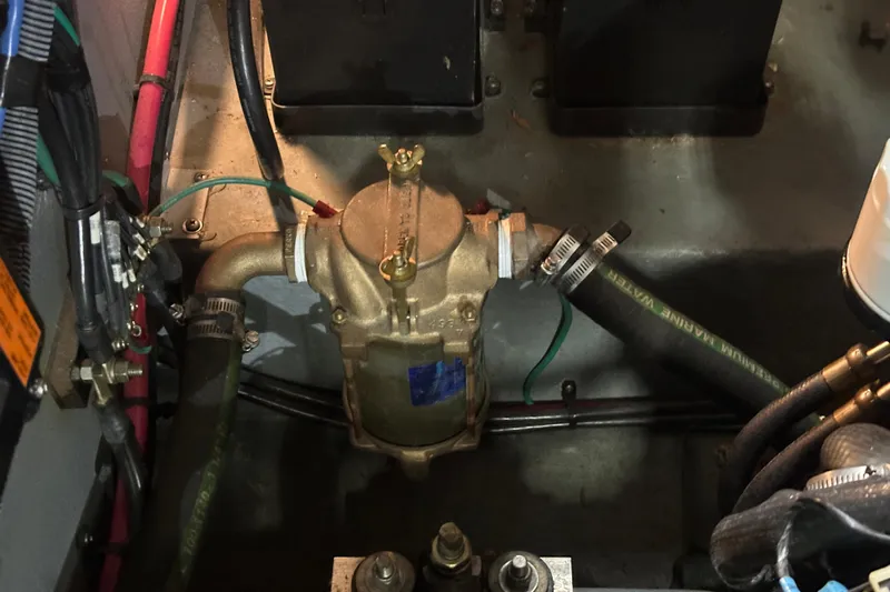  Yacht Photos Pics Engine compartment of 2004 Sea Ray 340 Sundancer with visible hoses and wiring.