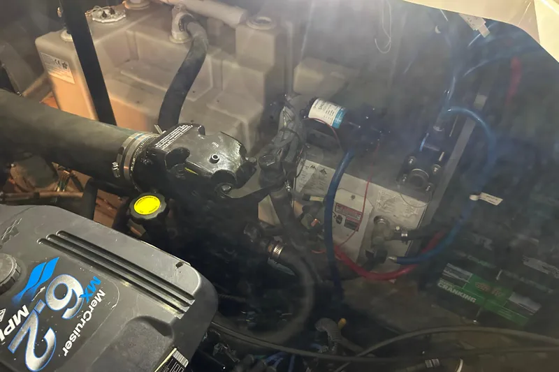  Yacht Photos Pics Engine compartment of a 2004 Sea Ray 340 Sundancer boat, featuring a MerCruiser 6.2 engine.