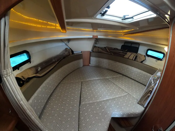  Yacht Photos Pics 2020 Ranger Tugs R-27 cabin interior with cozy seating and ambient lighting.