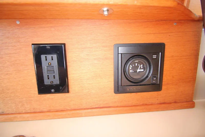  Yacht Photos Pics Electrical outlet and gauge on 2020 Ranger Tugs R-27 wooden panel.