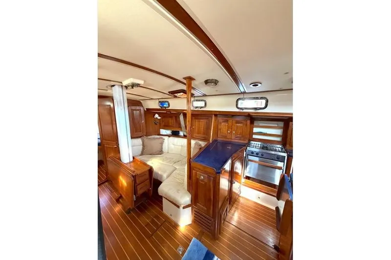 R'liberty Yacht Photos Pics Interior of 2001 Tartan 3700 yacht with wood finish and cozy seating area.