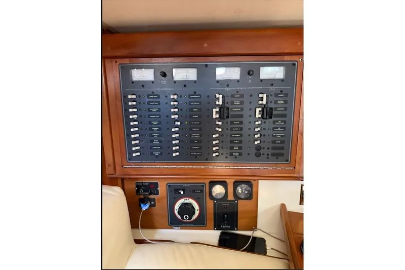 R'liberty Yacht Photos Pics Electrical control panel on a 2001 Tartan 3700 yacht, featuring switches and gauges.