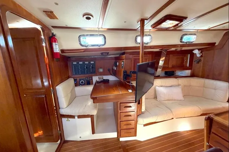 R'liberty Yacht Photos Pics Interior of 2001 Tartan 3700 sailboat with wood finish and cozy seating area.
