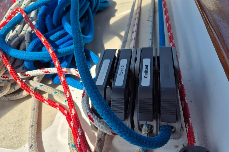 R'liberty Yacht Photos Pics Sailboat rigging with labeled clutches and colorful ropes on a 2001 Tartan 3700.