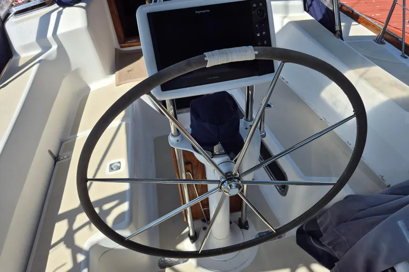 R'liberty Yacht Photos Pics Steering wheel and navigation system on a 2001 Tartan 3700 sailboat.