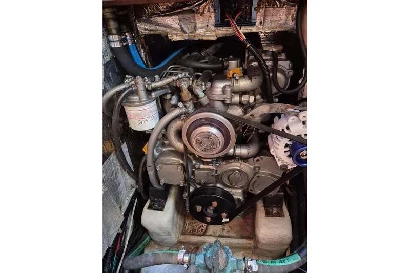 R'liberty Yacht Photos Pics Engine compartment of a 2001 Tartan 3700 sailboat, showcasing mechanical components and hoses.