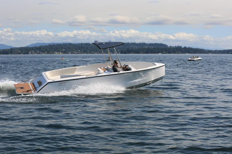 Yacht Photos Pics 2025 Zin Boats Z7 cruising. Roof and swim platform open.