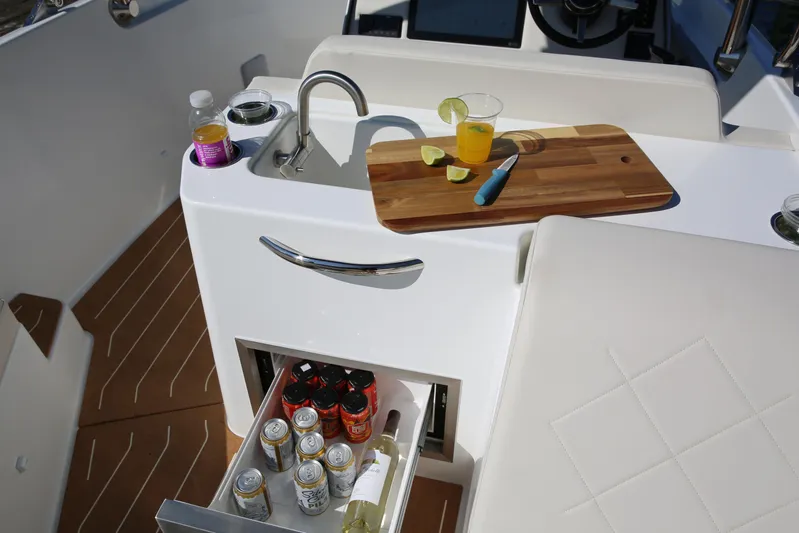  Yacht Photos Pics Luxury Zin Boats Z7 2025 interior with sink, cutting board, and beverage storage and fridge.