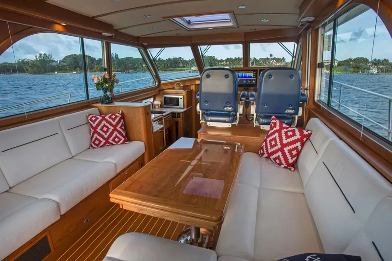  Yacht Photos Pics Luxurious interior of 2025 Sabre 45 Salon Express yacht with plush seating and scenic views.