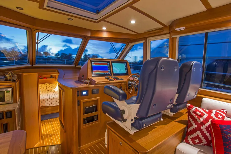  Yacht Photos Pics Interior of 2025 Sabre 45 Salon Express yacht with modern helm and luxurious seating.