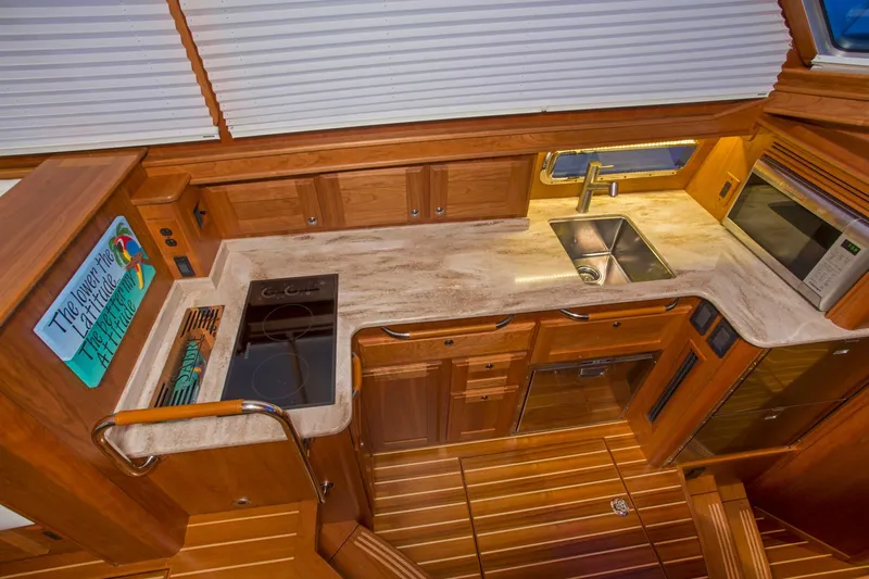  Yacht Photos Pics Luxurious kitchen interior of 2025 Sabre 45 Salon Express yacht with modern amenities.