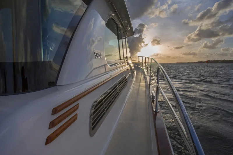  Yacht Photos Pics 2025 Sabre 45 Salon Express yacht cruising at sunset on open water.
